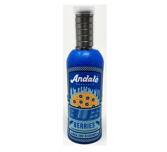 A bottle of Andale Blue Berries Honey and Beeswax candles, featuring a vibrant blue label with a cookie graphic and a black ribbed wick cap, set against a plain white background.