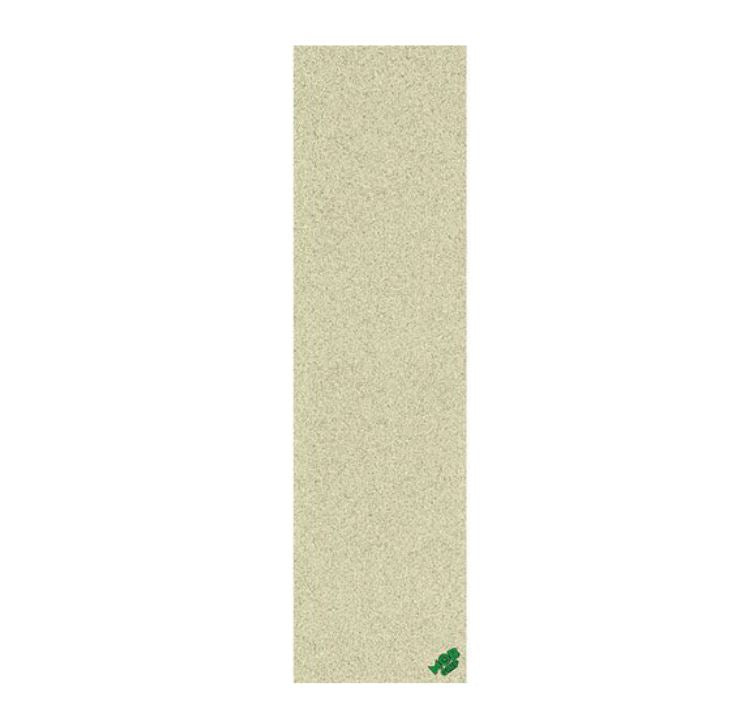 A vertical rectangular sample of textured grip tape in a light sandy beige color, featuring a small green logo in the bottom right corner, set against a solid white background.