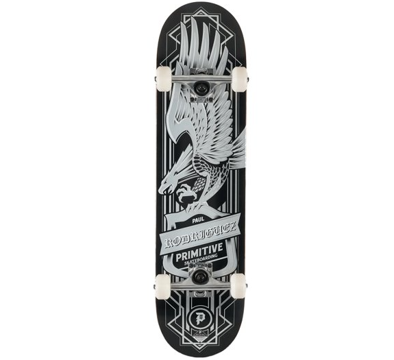 A skateboard deck shown from the underside, featuring a black background with a large white and gray eagle graphic and the text 'PRIMITIVE' and 'WILD AT 20'. The deck is mounted on white wheels with black trucks, photographed against a plain white background.
